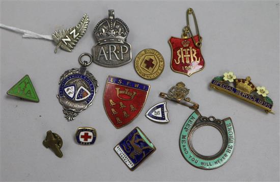 A collection of World War II military and other badges, including a WWI NZ Expeditionary Force Sweetheart, made by JR Gaunt, London.